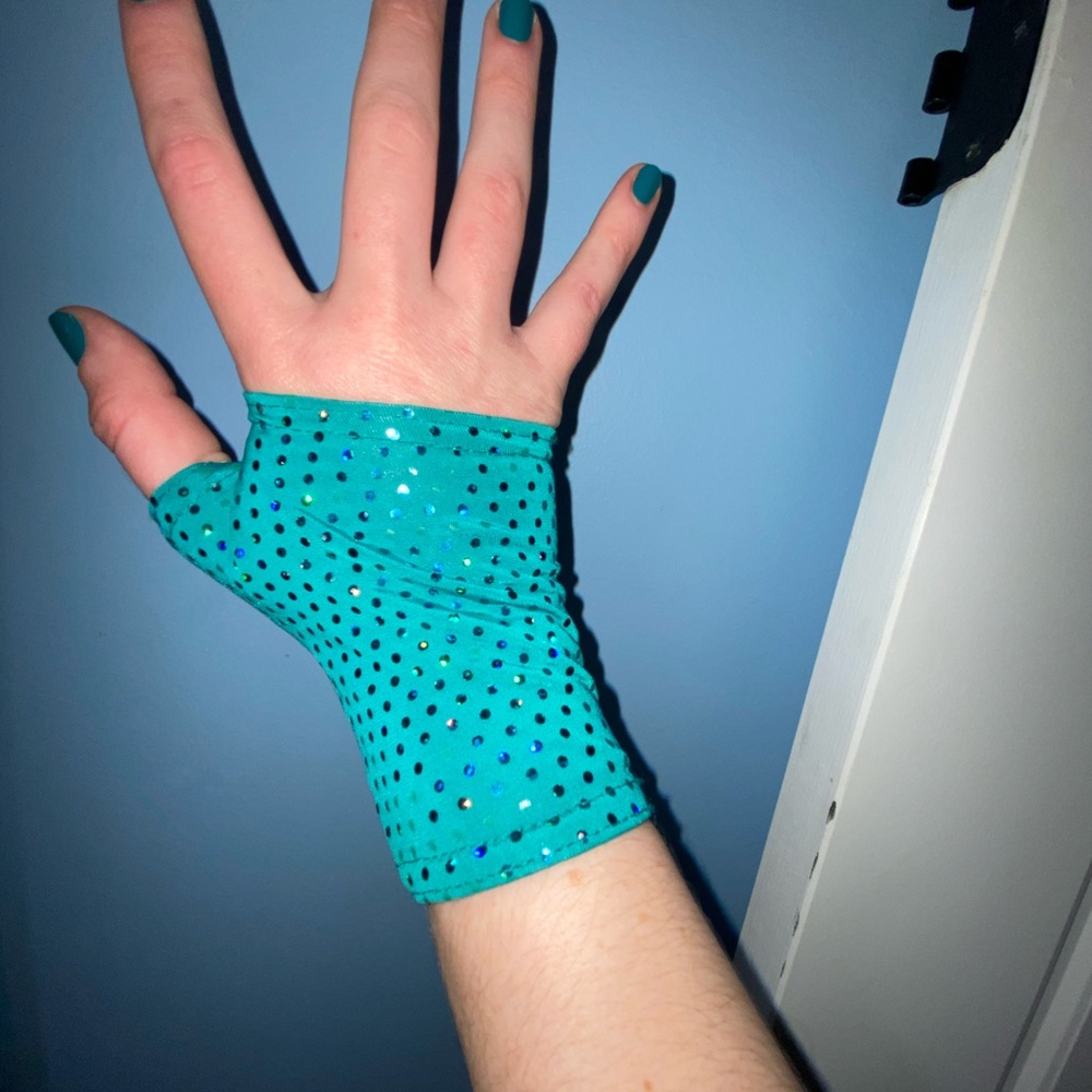 Teal and sequined hip hop dance outfit.